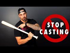 a man holding two baseball bats with the words stop casting in front of his face