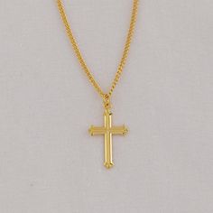 Our Cross Necklace combines timeless symbolism with exquisite craftsmanship. Meticulously crafted to be a daily reminder of Christ's love and sacrifice, it serves as a tangible connection to your beliefs. Whether worn visibly or tucked close to your heart, it serves as a personal altar, inviting moments of prayer and reflection throughout your day. * Dimensions: 1.2" x 0.7" (31mm x 18mm) * Weight of medal: 1.4 Grams. Comes with a 13", 16", 18", or 20" chain. Spiritual Hallmarked Crucifix Necklace, Formal Spiritual Crucifix Jewelry, Classic Gold Crucifix Necklace, Classic Engraved Crucifix Necklace, Classic Engraved Crucifix Jewelry, Classic Hallmarked Crucifix Jewelry, Engraved Cross Necklace For Blessing, Gold Cross Pendant Jewelry For Blessing, Gold Cross Jewelry For Blessing