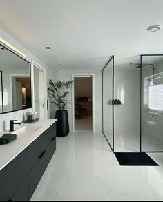 a large bathroom with white walls and flooring