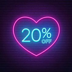 a neon sign that says 30 % off in the shape of a heart on a brick wall