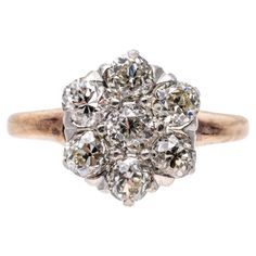 10k rose and white gold ring. This beautiful vintage ring is a round diamond cluster, set with old European cut diamonds, VS to SI clarity, approximately 0.56 TCW and prong set. Marks: None, tests 10k Dimensions: 5/16" diameter Weight: 1.6 gross dwt Vintage White Cluster Ring With Rose Cut Diamonds, Vintage Rose Gold Diamond Ring With Prong Setting, Vintage Cluster Diamond Ring With Rose Cut, Antique Cluster Diamond Ring With Accents, Vintage White Cluster Diamond Ring, Antique Diamond White Cluster Ring, Vintage Rose Gold Cluster Ring For Anniversary, Vintage Diamond Cluster Ring With Halo Setting, Vintage Cluster Diamond Ring With Halo Setting