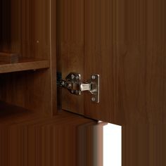 an open wooden door with metal handles