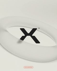 the letter x is placed on top of an object with black and white letters in it