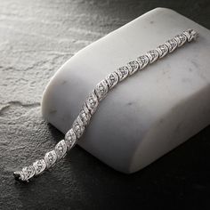 Ross-Simons - 1.00 ct. t. w. Diamond Bracelet in Sterling Silver. 8". Alight with 1.00 ct. t. w. baguette and round brilliant-cut diamonds, our twinkling bracelet is the epitome of elegance. Set in polished sterling silver, it's not only dazzling - it's affordable, too! Figure 8 safety. Box clasp, diamond bracelet. Diamond birthstones are the perfect gift for April birthdays. Classic Diamond Bracelet With Baguette Diamonds For Anniversary, Timeless Baguette Diamond Bracelet For Anniversary, Timeless Tennis Bracelet With Baguette Diamonds, Baguette Cut Diamond Bracelet With Diamond Accents For Anniversary, Anniversary Diamond Bracelet With Baguette Diamonds, Anniversary Baguette Diamond Bracelet, Timeless Diamond Bracelet With Baguette Cut Accents, Classic Diamond White Tennis Bracelet With Baguette Diamonds, Anniversary Baguette Cut Diamond Bracelet In Diamond White