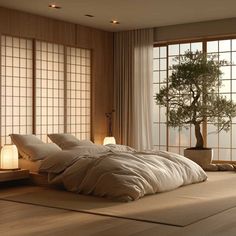 a large bed sitting next to a window in a room with wooden floors and tall windows