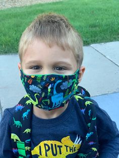 Little boys love dinosaurs! This mask is perfect for them. child face mask. Includes wire nose piece and adjustable elastic ear straps. Masks are made to order. Nose Piece, Boys Love, Carbon Emissions, Dinosaurs, Face Masks, Carnival Face Paint, Beauty And Personal Care, Onesies, Face Mask