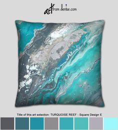 a blue and green pillow with an abstract painting on it's front, surrounded by color swatches