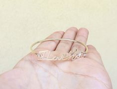 ♥ Personalized Handwriting Bangle is the most treasured jewelry you can find, perfect gift for you and your loved one. ∙ ∙ ∙ ∙ ∙ ∙ ∙ ∙ ∙ ∙ D E T A I L S ∙ ∙ ∙ ∙ ∙ ∙ ∙ ∙ ∙ ∙ * Material: High Quality Solid Sterling Silver 925 (safe for sensitive skin). * Open bangle style * Finish: Sterling Silver ∙ Yellow Gold Plated ∙ Rose Gold Plated * Handcrafted with Love and Care ♥ Our 18k gold plated jewelry is much thicker than other gold plating, resulting in a durable, long-lasting product. N O T E Avera Custom Name Bracelet Jewelry For Valentine's Day, Personalized Name Bangle Jewelry, Custom Name Bangle Jewelry As Gift, Custom Name Bangle Jewelry Gift, Customized Bangle Bracelets As Gift, Custom Name Bangle As Gift, Silver Cuff Bracelet With Custom Name For Gift, Custom Name Silver Cuff Bracelet As Gift, Custom Name Silver Cuff Bracelet For Gift