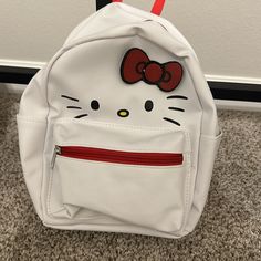 Mini Hello Kitty Backpack New. Large Backpack Also Available Kawaii White Backpack For Students, White School Bag With Zipper Closure, Kawaii White Backpack For Everyday Use, White Kawaii Backpack For Everyday Use, White Hello Kitty Kawaii Bag, White Student Bag With Cat Design, Trendy White Backpack With Cat Design, White Bag With Cat Design For Daily Use, White Hello Kitty Bag For Daily Use