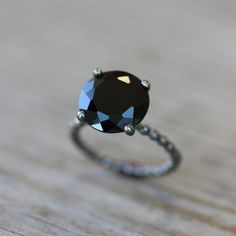 Black Spinel Solitaire Ring with Recycled AS WELL as Recycled Sterling Silver. This ring is given an oxidized finish to Blacken the silver. Oxidation wears over time but can be reapplied - just write us on how to :) For the Bright Polished Silver Version of this ring click here https://www.etsy.com/listing/172794808/black-spinel-ring-black-stone-ring?ref=shop_home_active_2&ga_search_query=black%2Bspinel. Spinel is a Precious stone, along with Rubies, Sapphires, Emeralds and Diamonds, but is perh Xoxo Necklace, Silver Door, Spinel Jewelry, Black Spinel Ring, Gold Flower Ring, Black Stone Ring, Winter Typ, Black Engagement Ring, Silver Cocktail