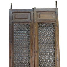 two wooden doors with intricate carvings on them