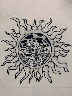 a drawing of a sun with faces on it