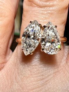 Certified Marquise & Pear Moissanite Toi et Moi (You and Me) Engagement Ring / Test Positive 🪛 Best Seller for 2023-2024!  Love these (you and me) rings.  So sentimental and romantic.  Very comfortable and easy to wear.   Premium quality Moissanite means you are purchasing a diamond which is internally flawless,  D color, made of silicon carbide and will test positive for a diamond.  These gemstones have the same physical, chemical, and optical properties as mined gems do. Mother Earth Moissanite does not "make" gems, but rather controls the environment so that crystals can grow naturally: recreating the conditions in which gems grow in the earth. Certification Included Diamond Weight: 1.5CT Marquise & 1CT Pear Color: D-E  Clarity: VVS1 Metal: 925 SS/ 9K / 14K Moissanite is a gemstone bor Dazzling Pear-shaped Gia Certified Rings, Gia Certified Teardrop Diamond Ring For Formal Occasions, Gia Certified Teardrop Ring For Anniversary, Gia Certified Pear-shaped Ring For Anniversary, Formal Gia Certified Teardrop Diamond Ring, Gia Certified Pear Diamond Ring, Gia Certified Pear-shaped Diamond Ring, Gia Certified Pear-shaped Anniversary Rings, Pear-shaped Gia Certified Rings For Anniversary