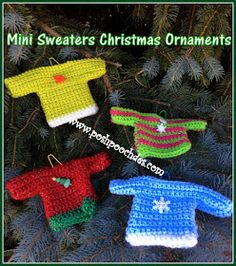 four crocheted sweaters hanging from a christmas tree with the words mini sweaters ornaments