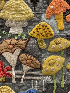 a close up of a piece of cloth with different types of mushrooms on the side