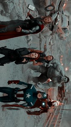 the avengers are standing in front of an iron man