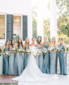 a bride and her bridals posing for a photo