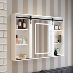 a bathroom with a sink, mirror and shelves on the wall next to each other