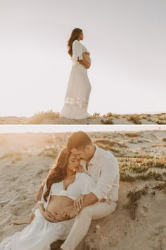 a pregnant woman sitting on the beach next to her husband and holding his belly in front of him