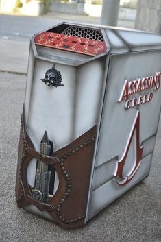 an unusual looking metal box sitting on the ground