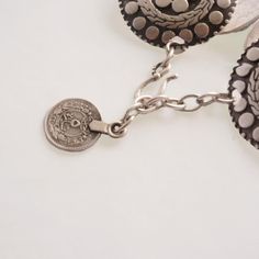 Four medallions of intricate circle designs come together to form this elegant piece. The Eternal Circles bracelet is full of exotic style and easy to wear with it's adjustable hook and chain closure.