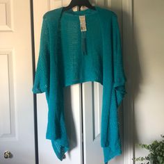 Light Knit Wrap In Turquoise Size S/M Blue Soft Knit Spring Cardigan, Blue Soft Knit Cardigan For Spring, Fitted Blue Open Knit Cardigan, Casual Light Blue Summer Sweater, Blue Knitted Summer Sweater, Blue Stretch Knit Cardigan, One Size Blue Knit Sweater, Fitted Blue Cardigan For Summer, One Size Blue Tops For Fall