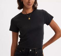 Essential Sporty T-shirt - Color:Black 
Model is 5'10" with a 26" waist. They're wearing a size small.

#Beyonce #LIVEINLEVII'S #Levi's Women's Spurs, Black Model, Shirt Color