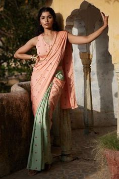 Peach, mint green pre-draped saree with bandhej print. Comes with blouse.
Component: 2
Pattern: Print
Type Of Work: Bandhej Print
Neckline: V neck
Sleeve Type: Sleeveless
Fabric: Modal
Color: Peach
Other Details: 
Pocket on the side
Occasion: Destination Wedding - Aza Fashions Saree With Pocket, Pre Draped Saree, Bandhej Print, Draped Saree, Stitched Saree, Peach Saree, Fancy Sarees Party Wear, Saree Poses, Drape Saree