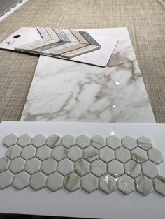 some white marble tiles on top of a table