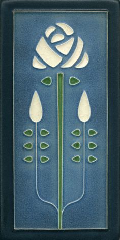 a blue tile with white flowers and green stems on the bottom, in front of a black frame