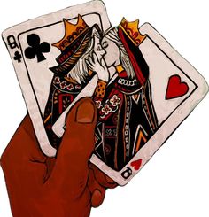 a hand holding two playing cards in front of a white background