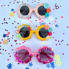 "These personalizable sunglasses are the perfect for your littles this spring and summer! There are many colors to choose from, and the customization possibilities are endless! Add your child's name, or a cute phrase like \"flower power\", \"sunflower cutie\", \"mini\", etc.  These make a great gift for events, baby showers, photoshoots, sleepovers, birthday parties and more! HOW TO ORDER: 1. Choose the color of sunglasses 2. Select your style * If personalized add your customization in the personalization box (max of 10 characters) *The flowers will be chosen based off of the sunglasses color you choose - we will choose whatever matches them the best! NOTE: additional customization is available please message me for further details. * Anti-Glare * UV Protection (UVA & UVB) * Durable and s Custom Name Fun Sunglasses For Summer, Playful Personalized Pink Sunglasses, Pink Personalized Adjustable Sunglasses, Custom Name Sunglasses For Summer Beach, Custom Name Sunglasses For Beach In Summer, Custom Name Sunglasses As Summer Gift, Cute Personalized Summer Sunglasses, Custom Name Pink Sunglasses With Adjustable Fit, Summer Sunglasses With Uv Protection For Gift