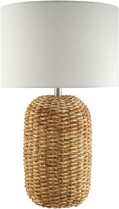 a wicker table lamp with a white shade on the top and bottom part of it