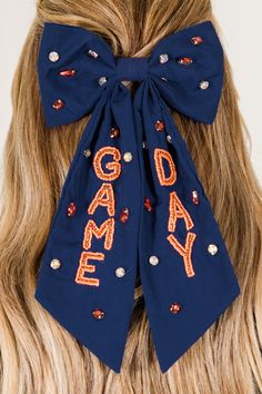 Score a game day with this bow! The navy bow is embellished with beaded lettering and sparkly rhinestones, making it the perfect accessory for your game day look! Don't leave your luck up to chance, grab this playful and fun bow today! Navy Game Day Outfit, Game Day Accessories, Collegiate Navy Top For Game Day, Navy Pre-shrunk Tops For Game Day, Auburn Gameday Outfit Navy, A&m Gameday Outfit, Jumpsuit Party, Tunic Sweatshirt, Gameday Outfit