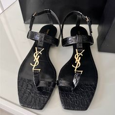 % Authentic, Brand New, Never Worn, Black Leather Saint Laurent Cassandra Flat Sandals Eu Size 40 (Us 8.5-9) Designer Black Low Heel Sandals, Luxury Black Low Heel Sandals, Designer Black Sandals With Low Heel, Saint Laurent Sandals, Ysl Heels, Fringe Sandals, Red Sandals, Embellished Sandals, Leather Espadrilles