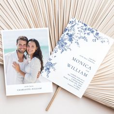 a wedding photo on top of a fan next to an envelope with the word monogrammed