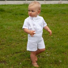 "Baby boy white linen outfit includes SET of 4: Shorts Suspenders Shirt Bow tie Shorts come in elastic waist adjustable with buttons. Suspenders are adjustable with buttons on the back and removable. The bow tie is pre-tied with adjustable Velcro closure on the back. You can order the appropriate size for your baby. Please see the size chart in the last image. It would be good if you could send the individual measurements - full height, waist and hip circumference. I will make this outfit exactl Toddler Baptism Outfit Boy, White Ring Bearer Outfit, Boy Suspenders Outfit, Formal Boys Outfit, White Linen Outfit, Baby Boy Linen, Shorts With Suspenders, Suspenders Outfit, White Linen Suit