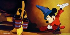 an animated mickey mouse with a witch hat on and another cartoon character in the background