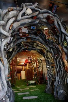 an archway made out of branches and other things