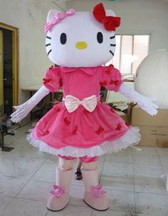 the hello kitty mascot is dressed in pink and white