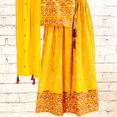 Mustard yellow georgette girls lehenga with computer embroidery choli top and lehenga with intricate sequence work. Includes matching mirror work dupatta & sleeves. Please Note: Color of the actual product may vary slightly from the image(s) shown. Mirror Work Dupatta, Top And Lehenga, Girls Lehenga, Yellow Girls, Gharara Suits, Positive Clothes, Gowns For Girls, Computer Embroidery, Sequence Work