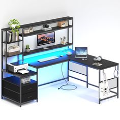 a computer desk with a monitor and keyboard