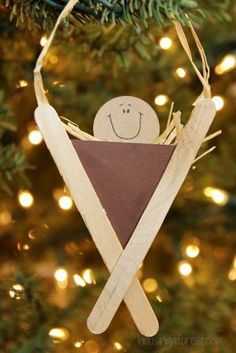 an ornament made to look like a triangle with a smiling face on it