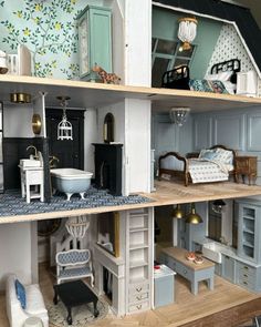 a doll house with furniture and accessories in it