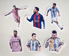 four stickers depicting different soccer players in various colors and sizes, each with their own name