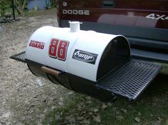 the back end of a truck with a mailbox on it