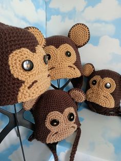 three monkey hats are sitting next to each other