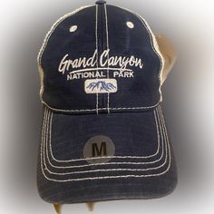 Elevate Your Style With This Navy Blue Snapback Hat Featuring The Stunning Grand Canyon National Park Embroidered On The Front. Made By Prairie Mountain, This Hat Is Perfect For Travel And Casual Wear. The Breathable Mesh Back And Adjustable Snap Closure Make It Comfortable To Wear All Day. Does Have Discoloration On Top Left Side Of Bill, Shown In Pictures. Does Still Have Tag On Item! Navy Travel Cap, Blue Flat Brim Hat With Letter Print, Casual Blue Hat For Travel, Blue Curved Brim Baseball Cap For Travel, Travel Blue Curved Brim Baseball Cap, Casual Travel Hat With Letter Print, Navy Casual Hat For Outdoor Activities, Blue Flat Brim Hat For Travel, Casual Navy Hat For Outdoor Activities