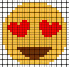 a cross stitch smiley face with red eyes