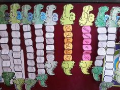 a bulletin board with writing on it and alligators in the letters that spell out